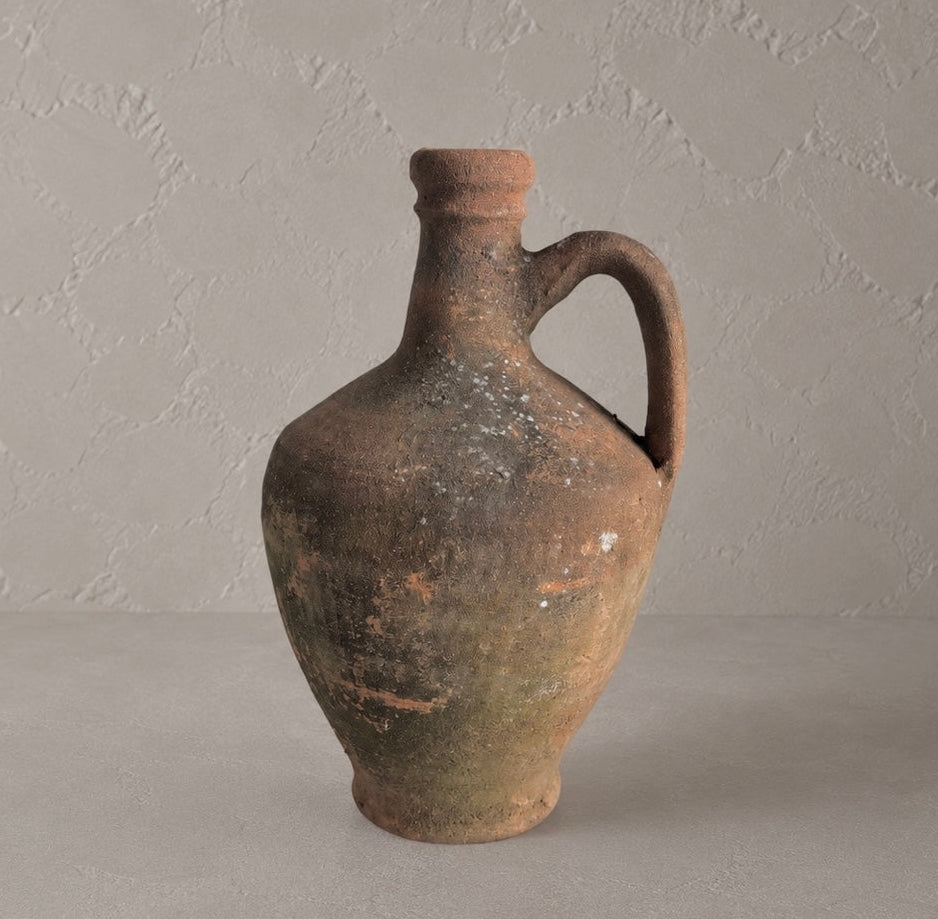 Small Vintage Amphora Vase No. I, 10-inch aged terracotta pottery vessel with single handle and timeworn brown and olive patina.