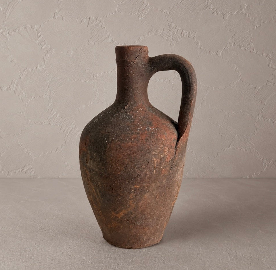 Small Vintage Amphora Vase No. I, 10-inch aged terracotta pottery vessel with single handle and timeworn brown and olive patina.